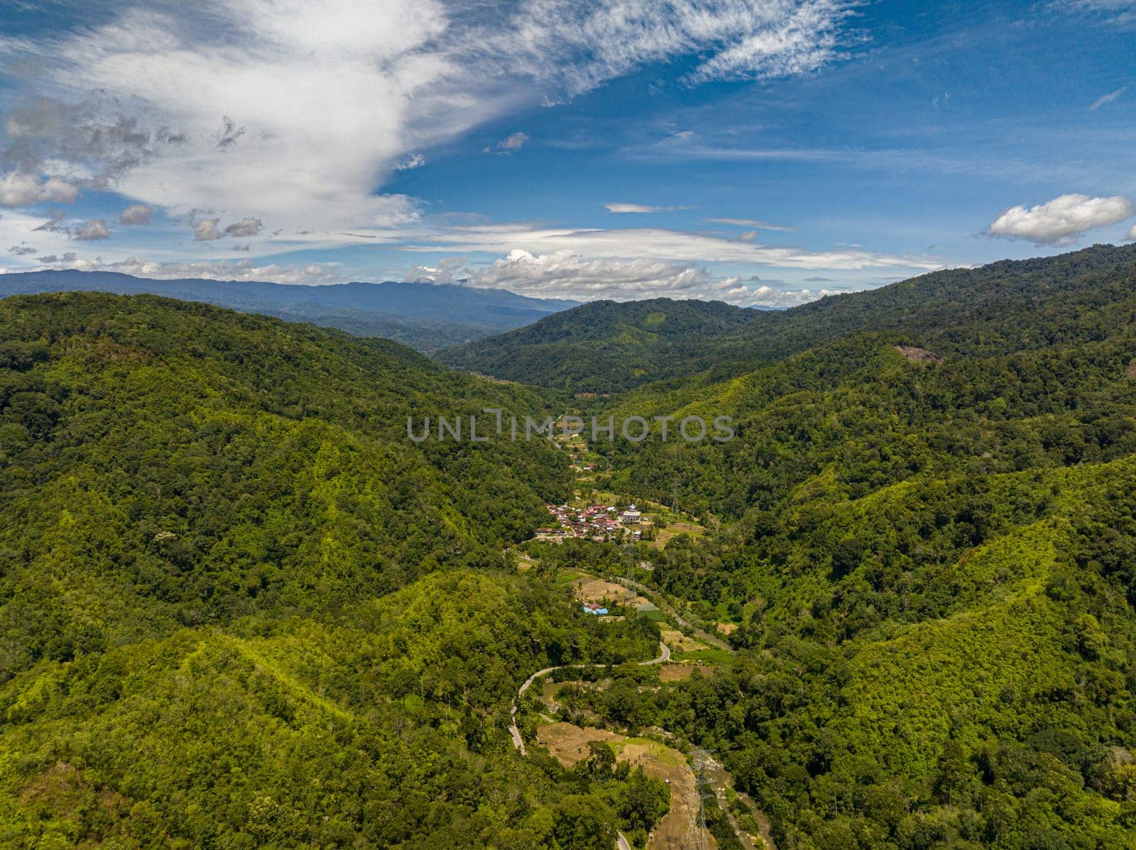 Mountain slopes covered with rainforest and jungle. Sumatra, Indonesia.