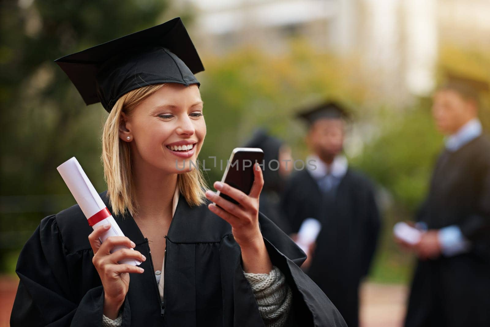 Graduation, certificate and phone with student woman outdoor on campus for university or college event. Mobile, communication and smile with young graduate at school for education or scholarship.