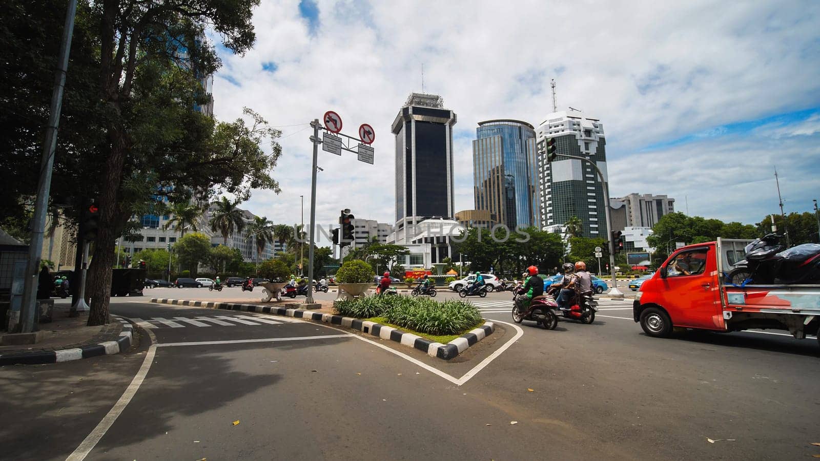 Jakarta's roads and streets with cars during the daytime