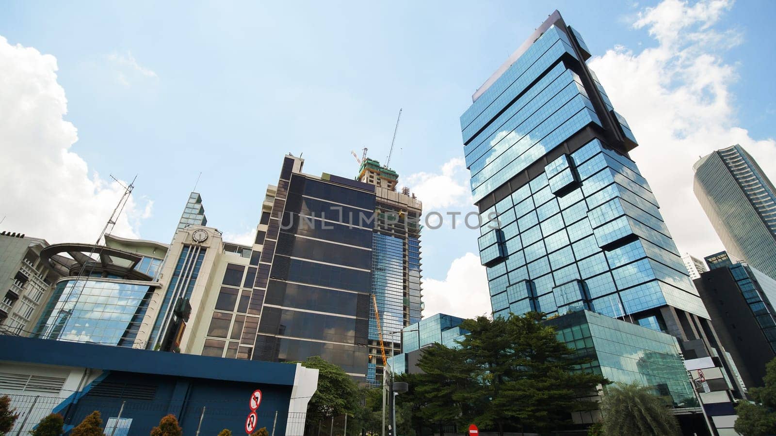 Skyscrapers of Jakarta, the capital of Indonesia, on a sunny day. by DovidPro