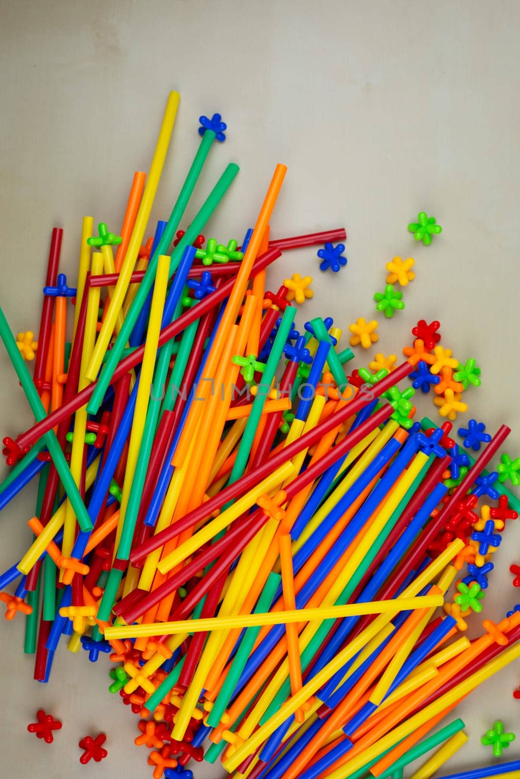 Plastic straws with special fastenings on the table, construction set for develops kid imagination and logic