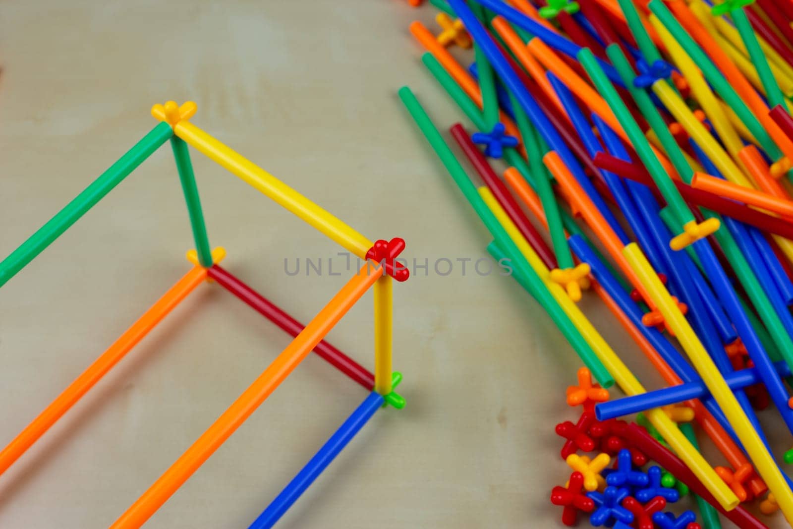 Frame made of plastic multi colored flexible tubes for children