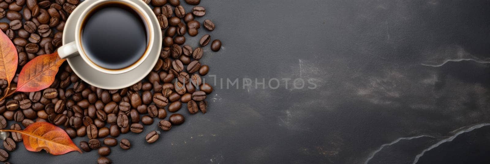 A cup of coffee is surrounded by beans and leaves