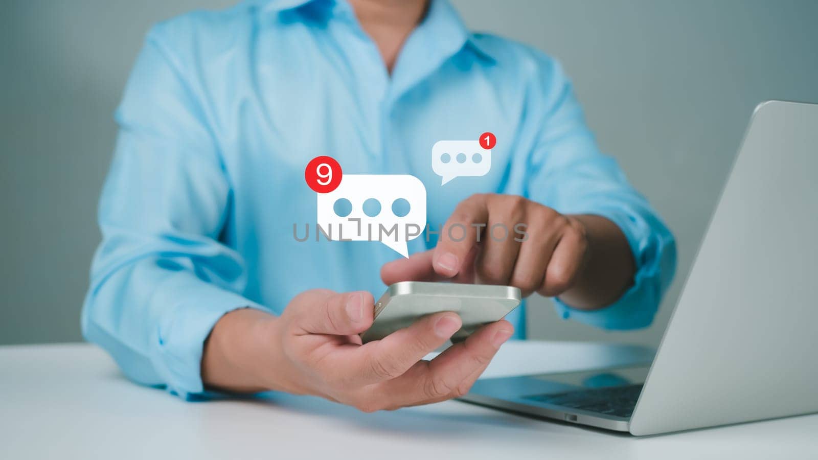 man using smartphone typing live chat chatting on application communication digital web and social network concept. Social media application chat box. by Unimages2527