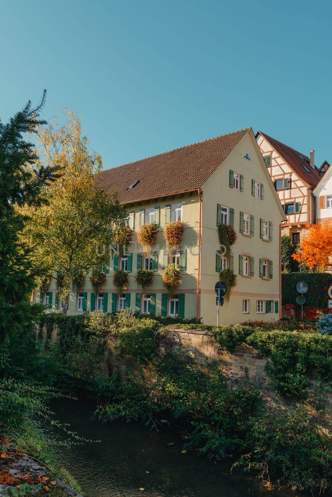 Old national German town house. Old Town is full of colorful and well preserved buildings. Baden-Wurttemberg is a state in southwest Germany bordering France and Switzerland. The Black Forest, known for its evergreen scenery and traditional villages, lies in the mountainous southwest. Stuttgart, the capital, is home to Wilhelma, a royal estate turned zoo and gardens. Porsche and Mercedes-Benz have headquarters and museums there. The 19th-century Hohenzollern Castle sits in the Swabian Alps to the south.