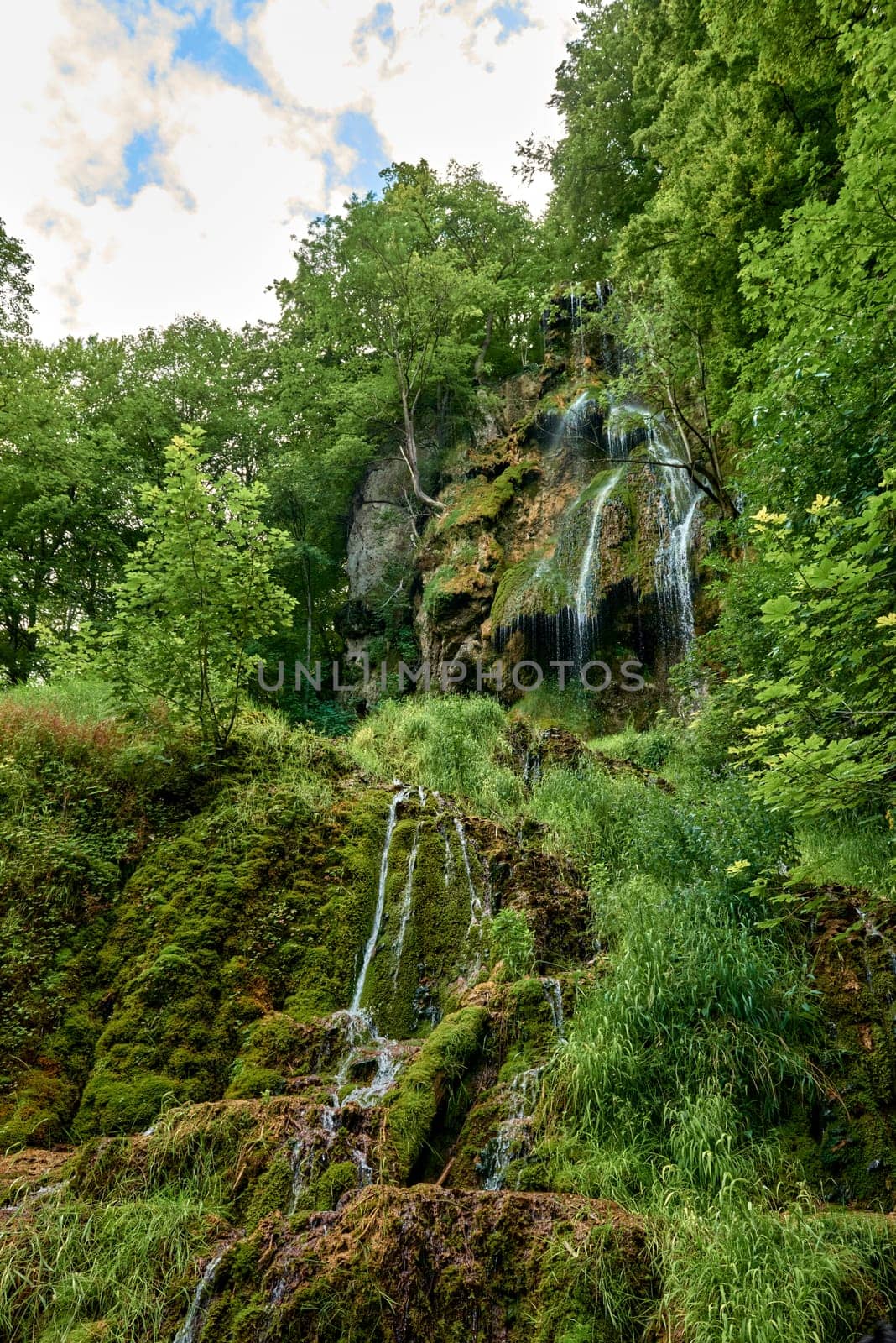 Urach Waterfall in Baden-Wurttemberg, Germany During Summer. Urach Waterfall in Baden-Wurttemberg, Germany During Summer by Andrii_Ko