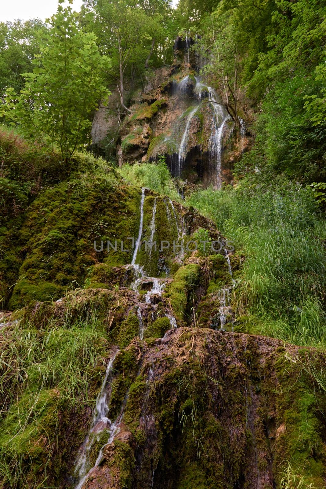 Urach Waterfall in Baden-Wurttemberg, Germany During Summer. Urach Waterfall in Baden-Wurttemberg, Germany During Summer by Andrii_Ko