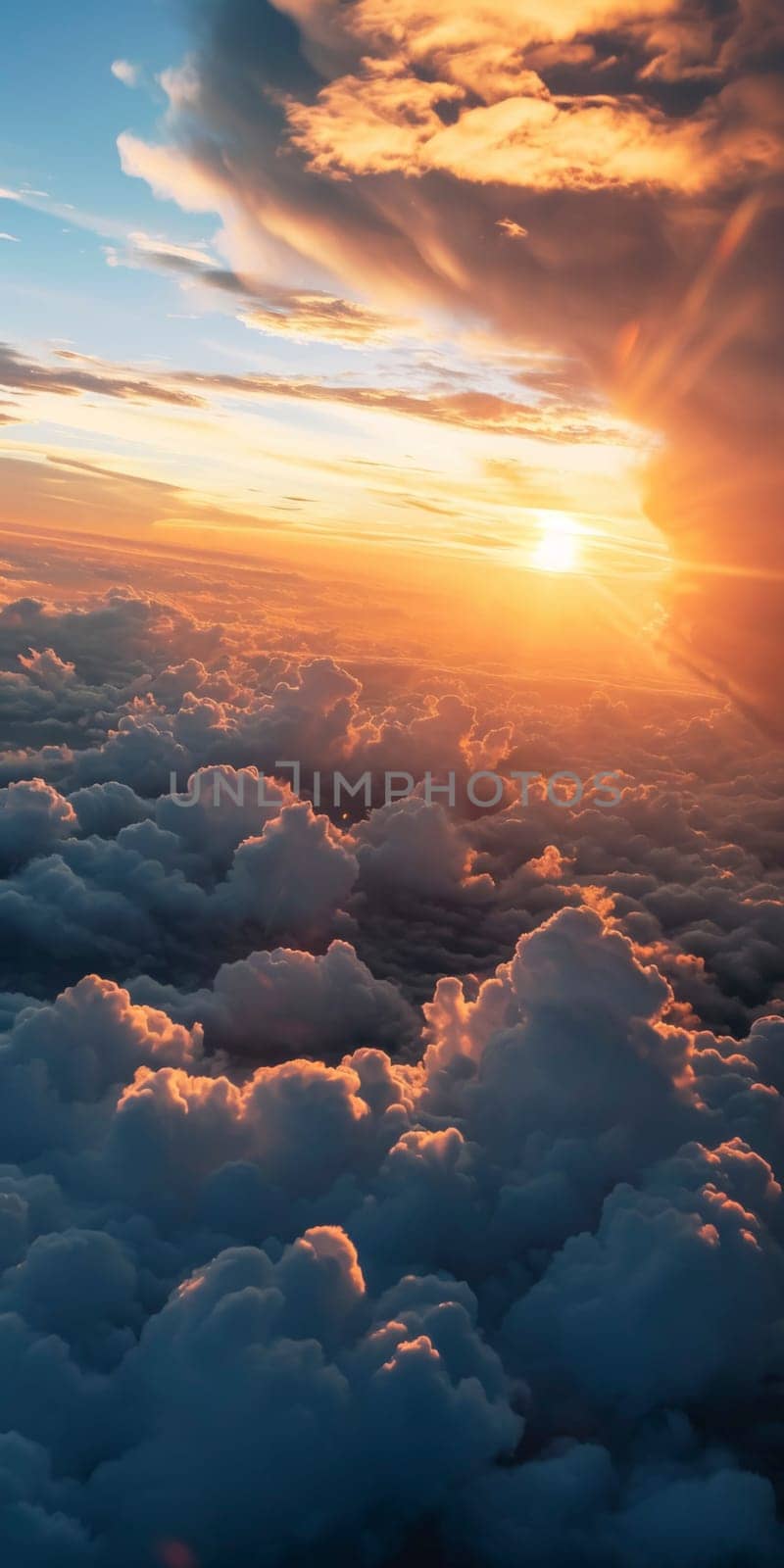 Sun rising over a sea of clouds, with warm light gracing the edges