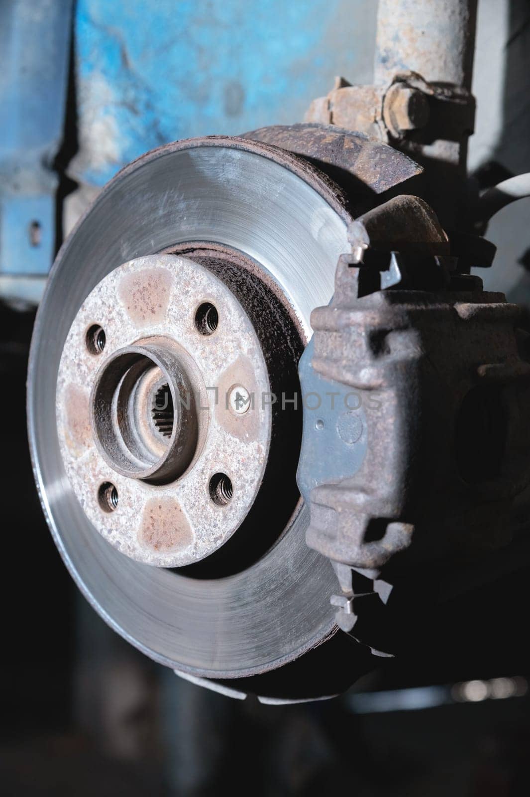 Disc brake disc with brake system installed on an old car.