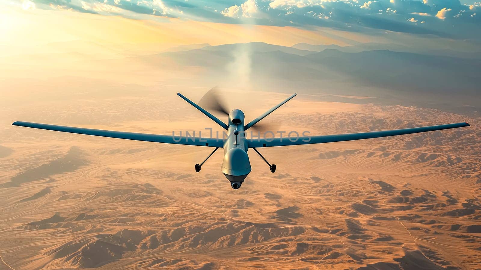 An aircraft is flying over a desert ecoregion during sunset, capturing the stunning landscape below against the colorful sky and clouds in the atmosphere