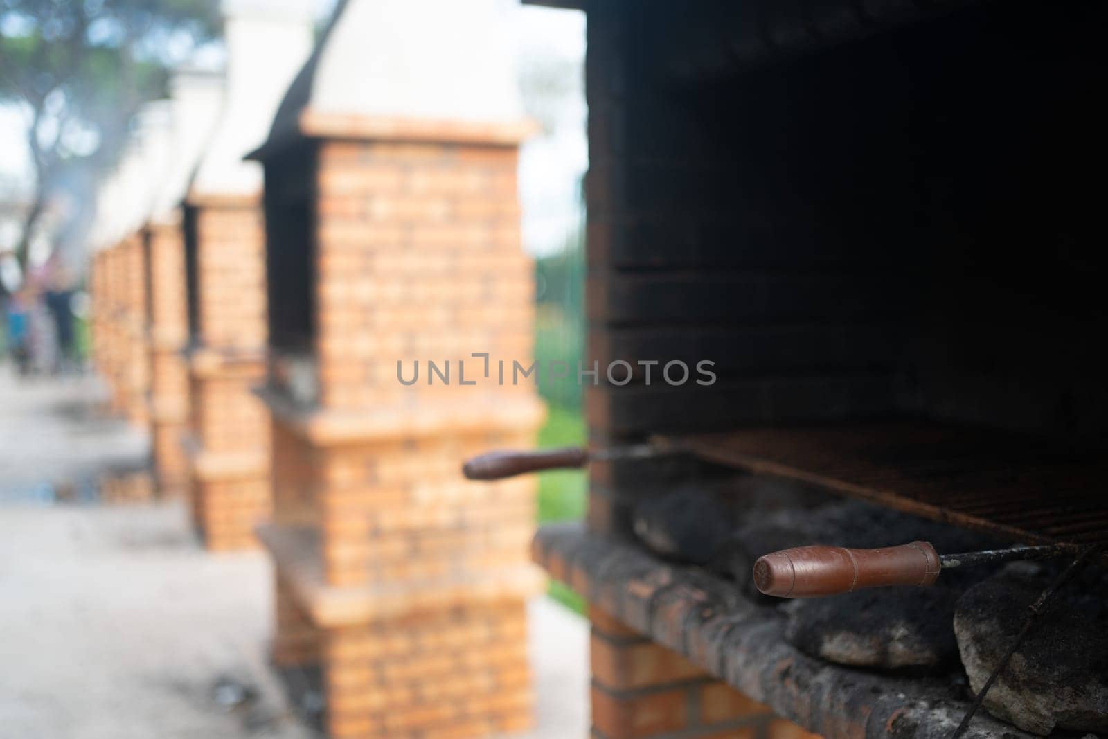 Outdoor BBQ made of bricks for cooking in public park by andreonegin
