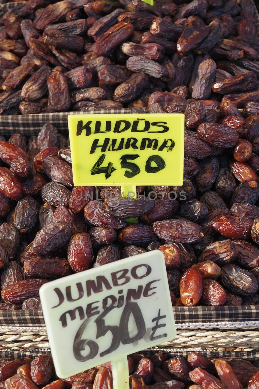 many date fruits display for sale at local market by towfiq007