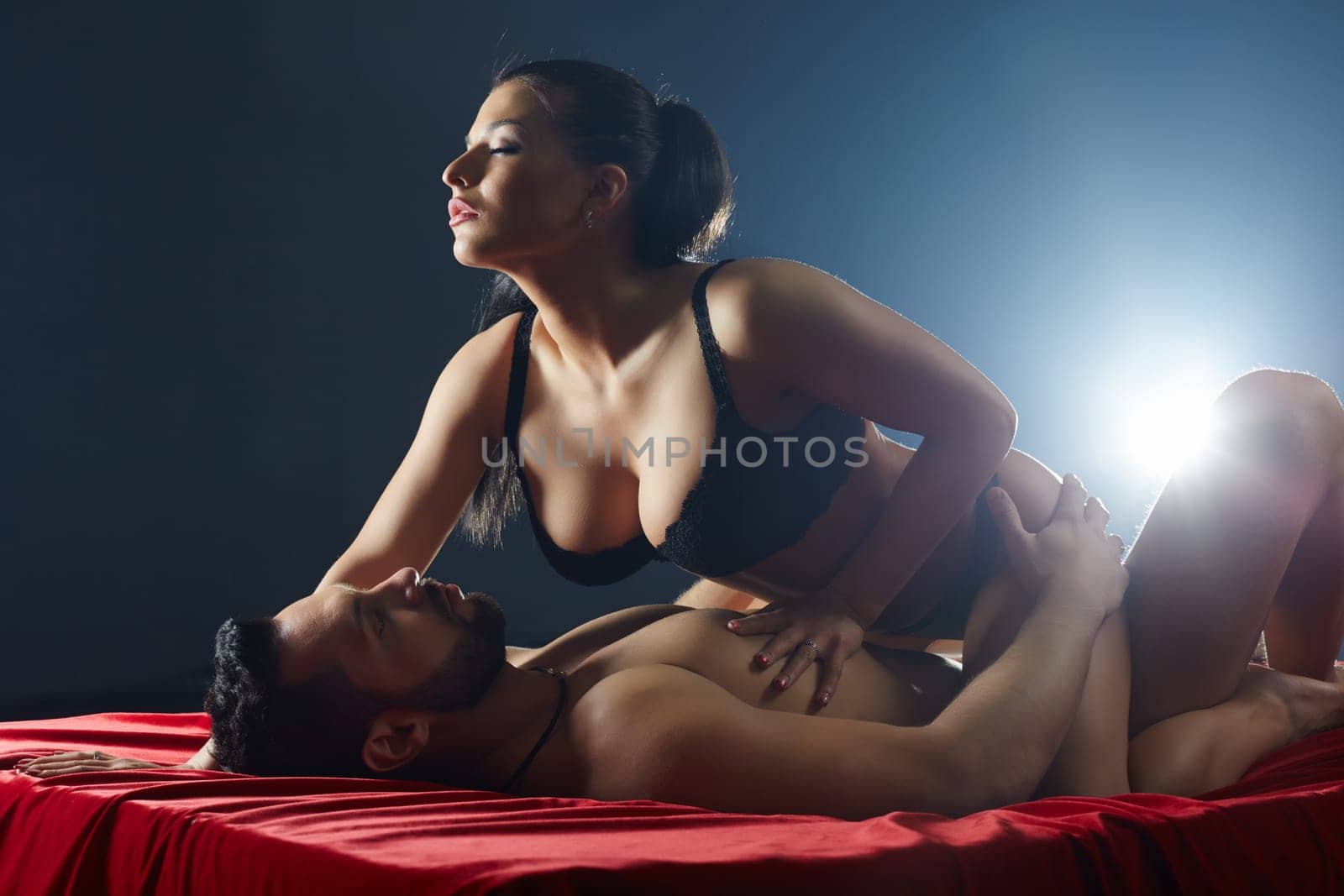 Couple passionately engaged in sex. Studio snapshot