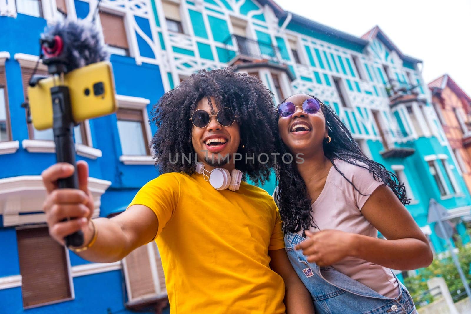 Content creators recording an online video in a colorful neighborhood by Huizi