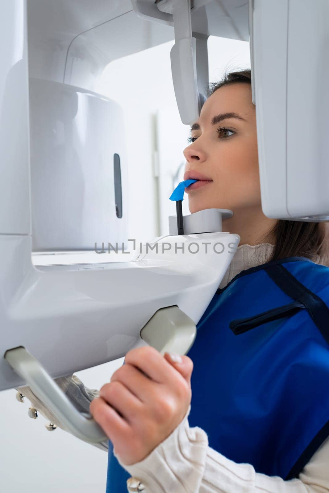 Panoramic Teeth X ray Being Administered to Young Woman at Dental Office. Teeth care.