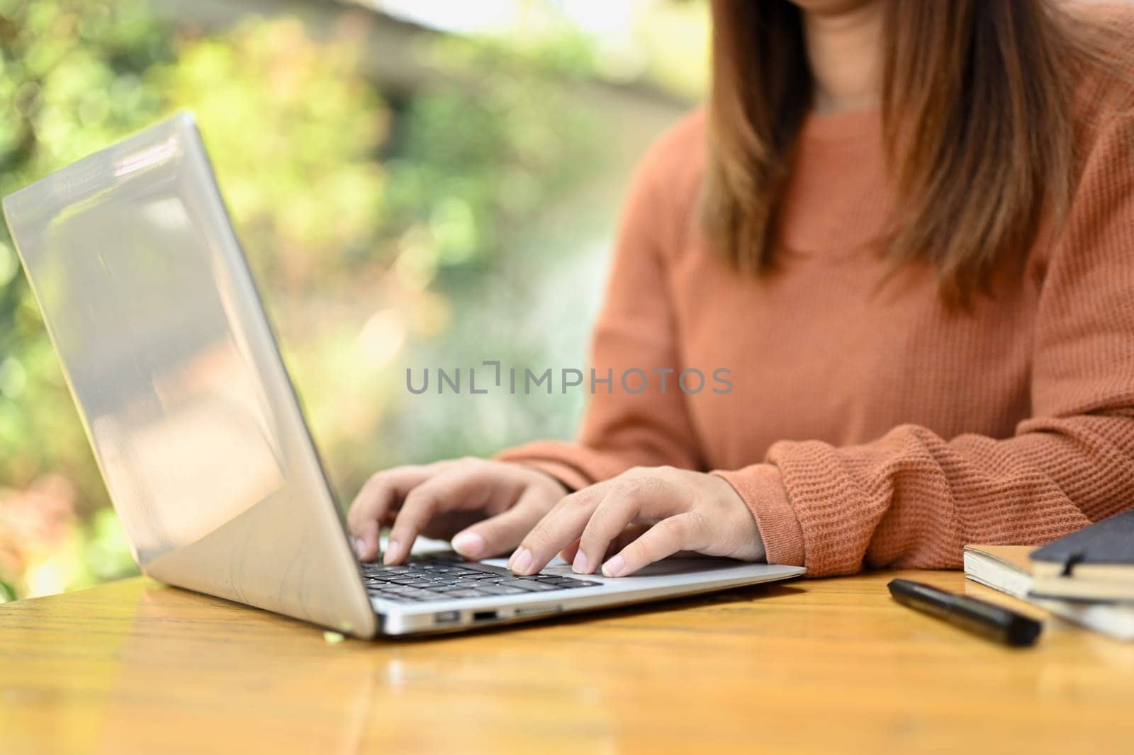 Young woman browsing internet, remote work or stying online on laptop at home.