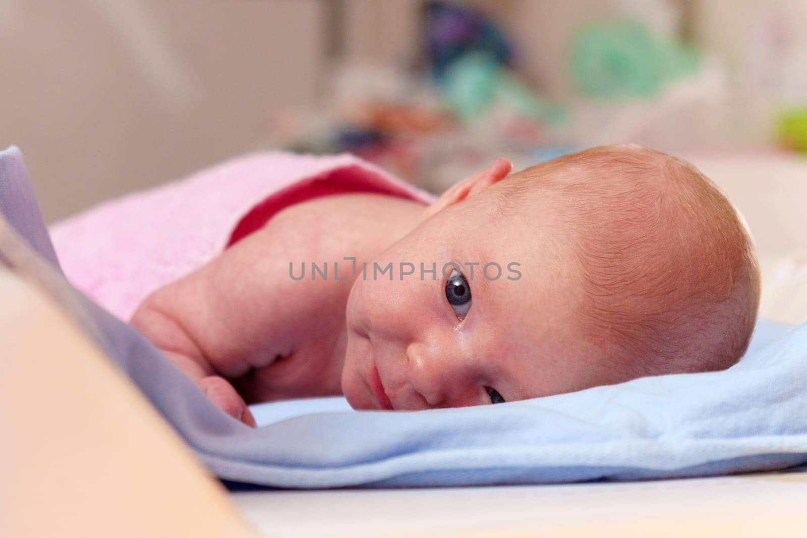 Early life, this close-up portrait reveals the tranquil beauty of a 2-month-old baby by darksoul72