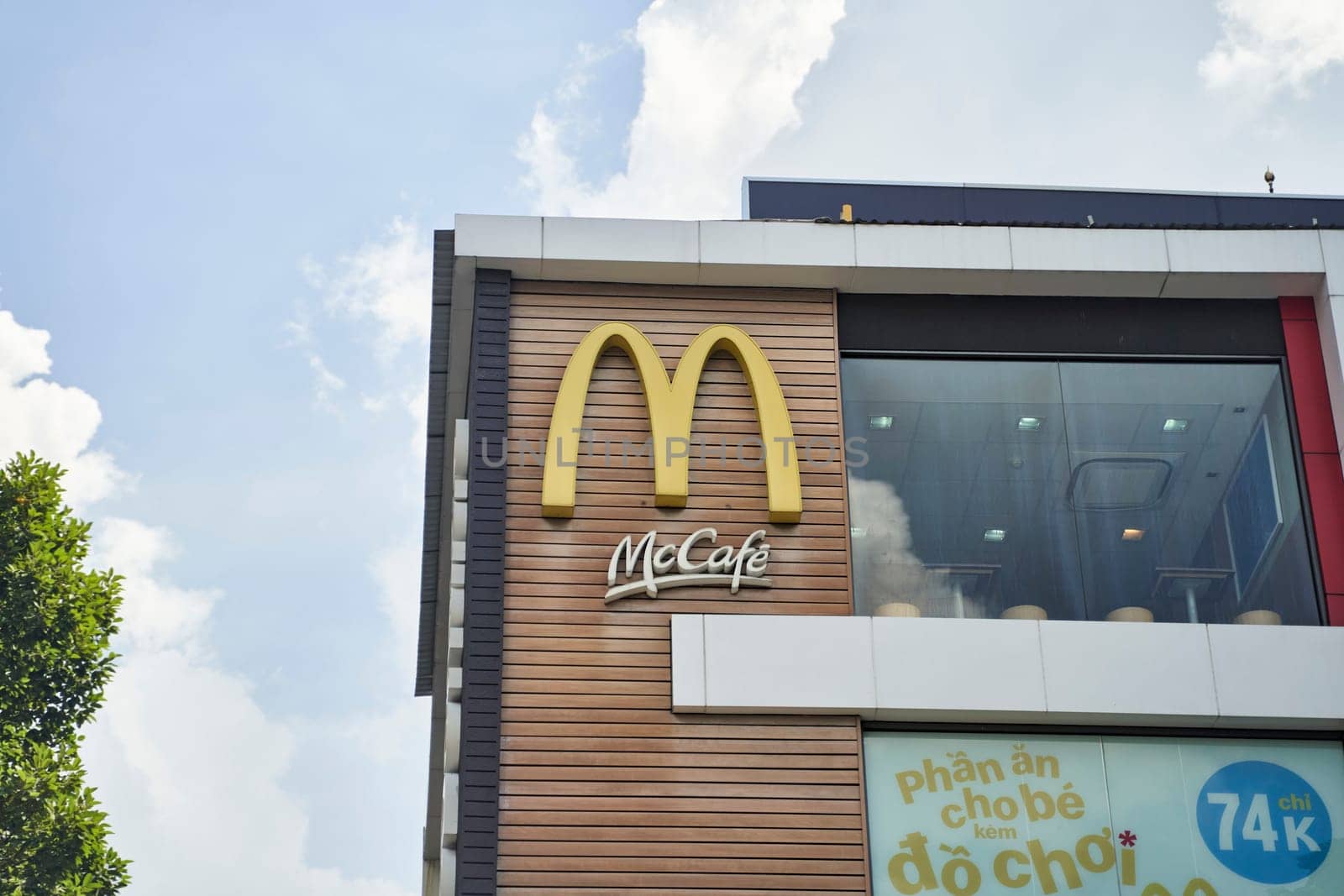 Ho Chi Minh City, Vietnam - 2.07.2023: Close-up of McDonald's logo and maccafe on building. High quality photo