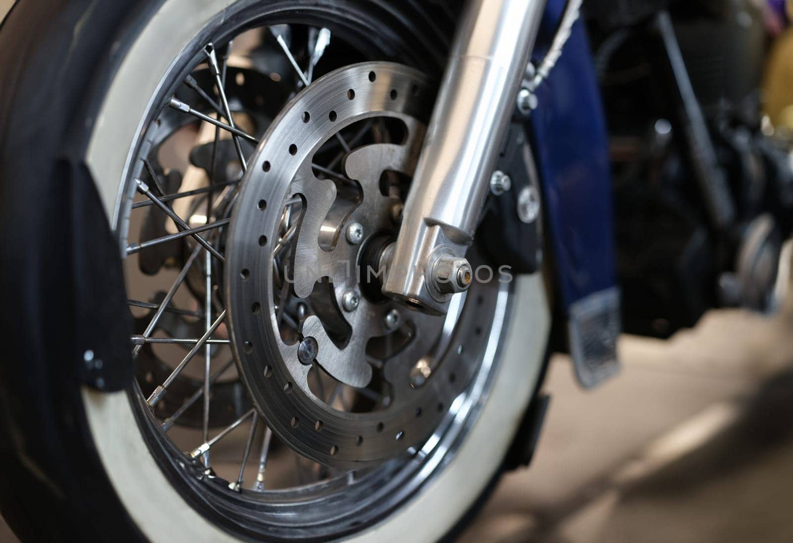 Closeup of brake disc on motorcycle wheel. Brake replacement motorcycle maintenance concept