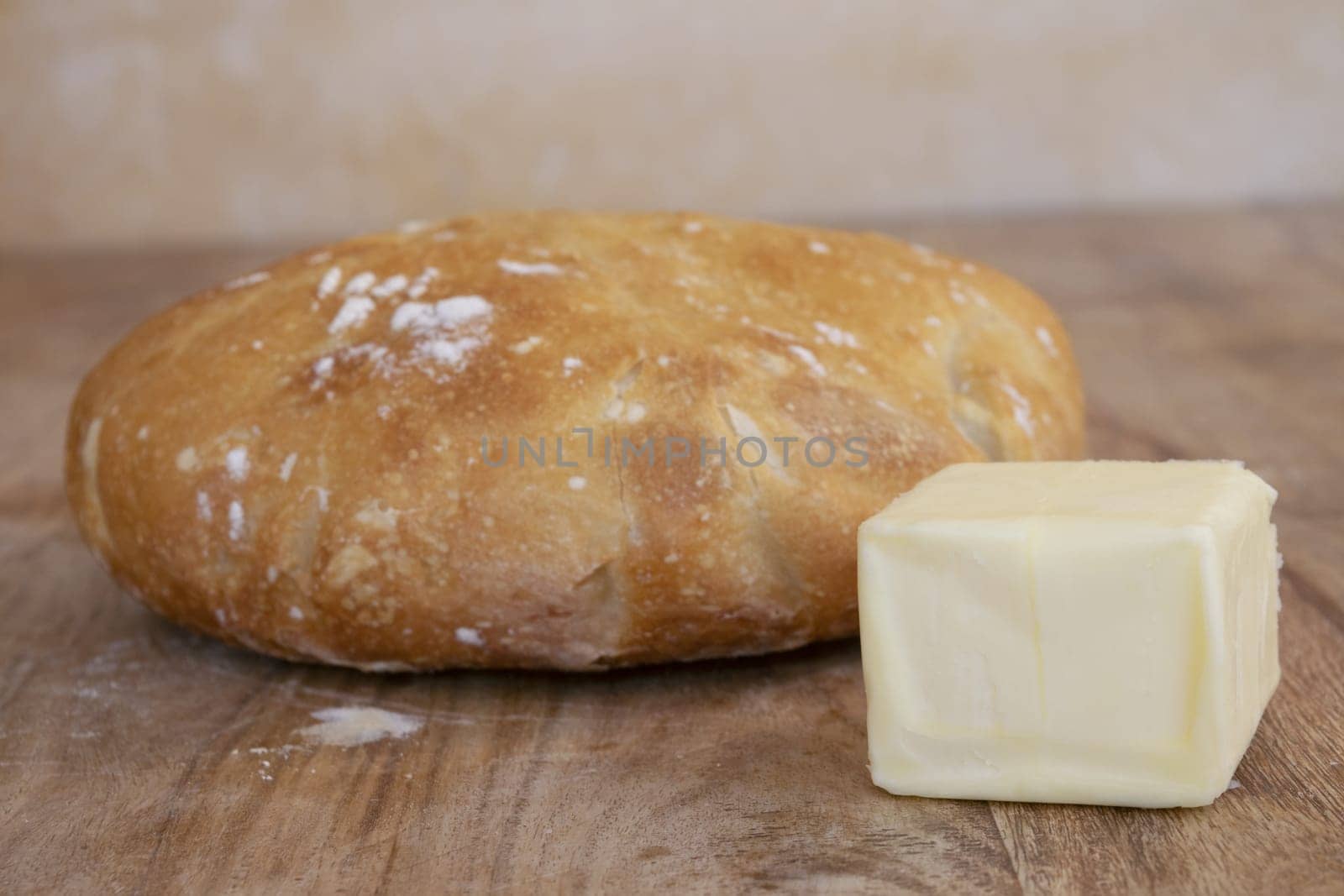 homemade bread loaf and a piece of butter