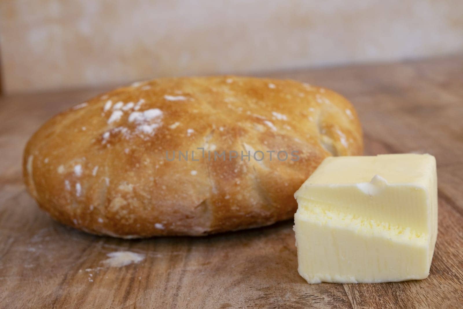 homemade bread loaf and a piece of butter