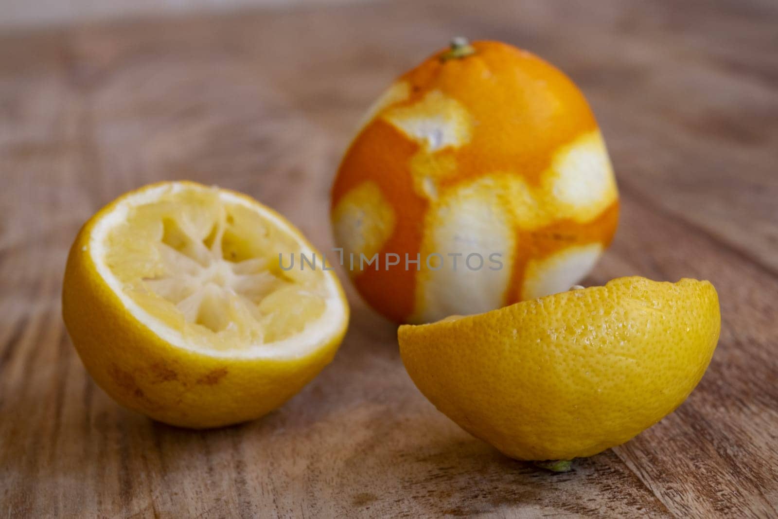 leftover lemons and oranges on a wooden table