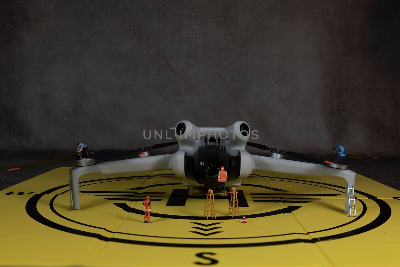 man checking the working of the video and photo camera drone and the propellers