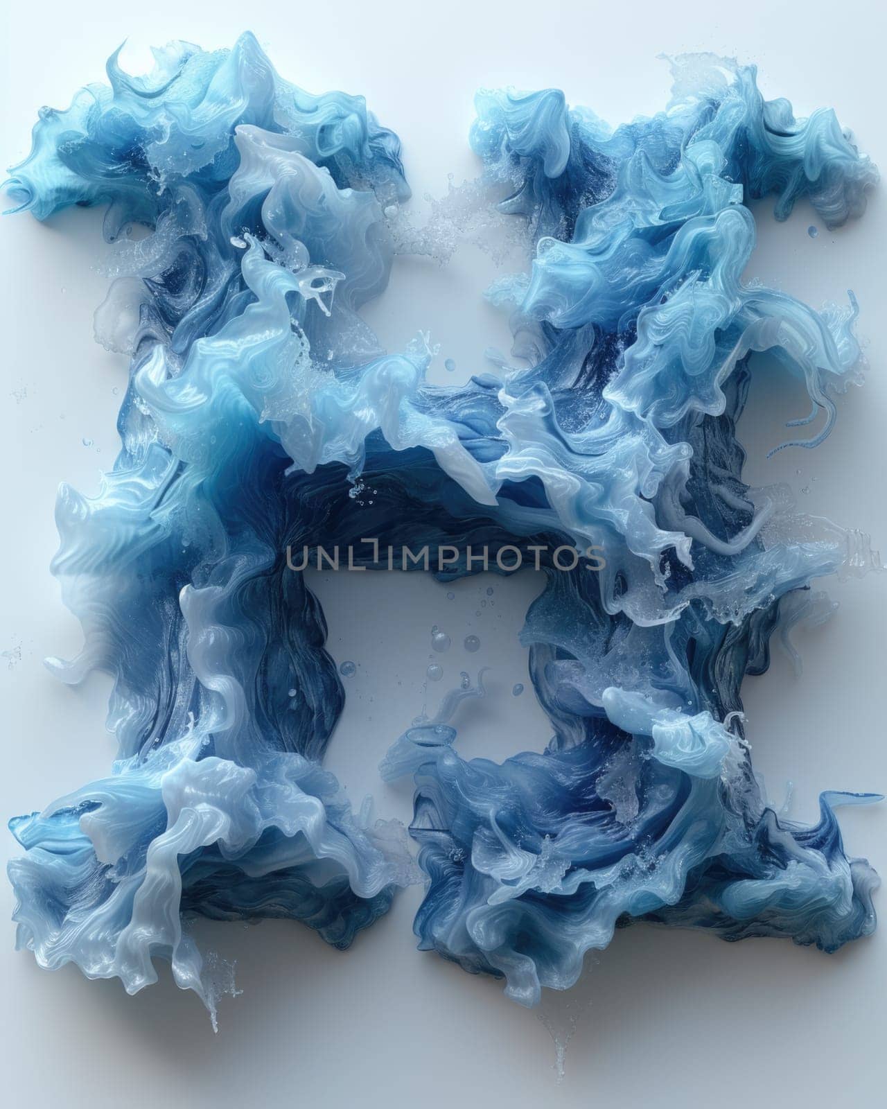 A letter made out of blue and white dye emerges as the sea engulfs the material, creating a striking visual contrast.
