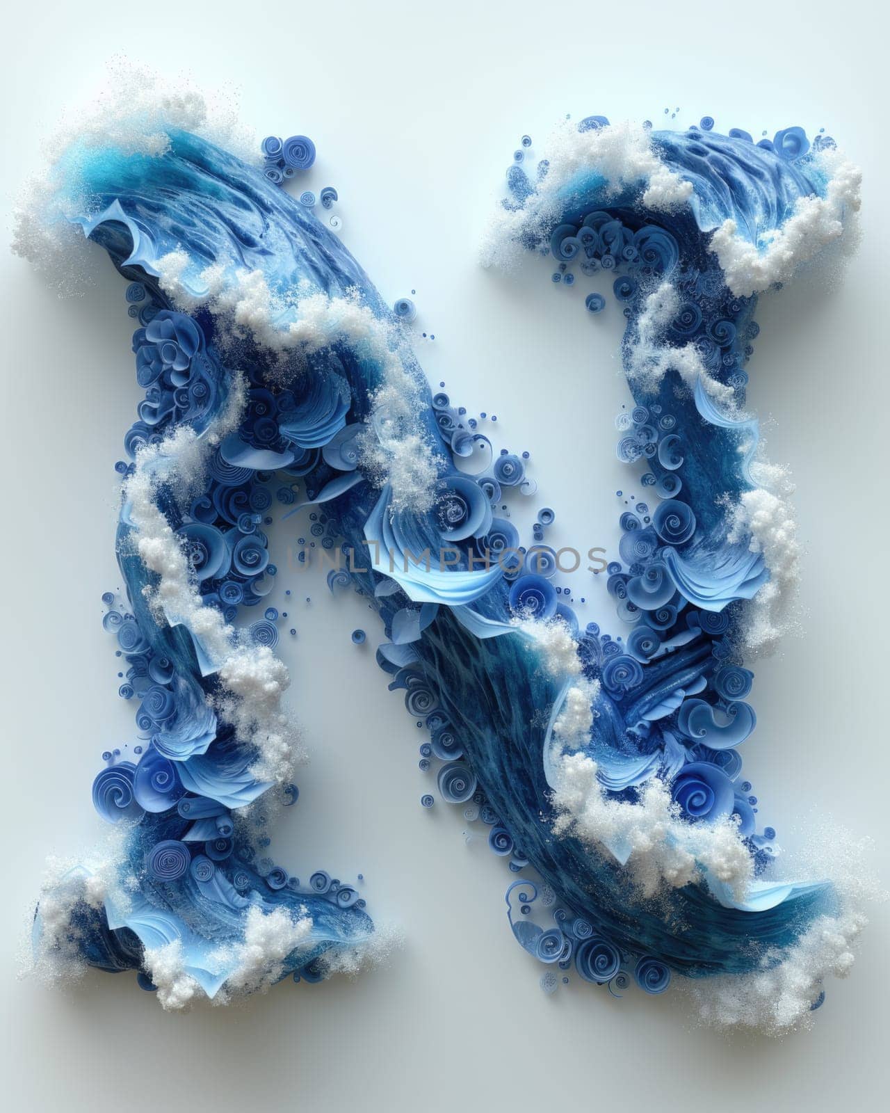 A letter made out of blue and white paper resting on the sandy seashore.