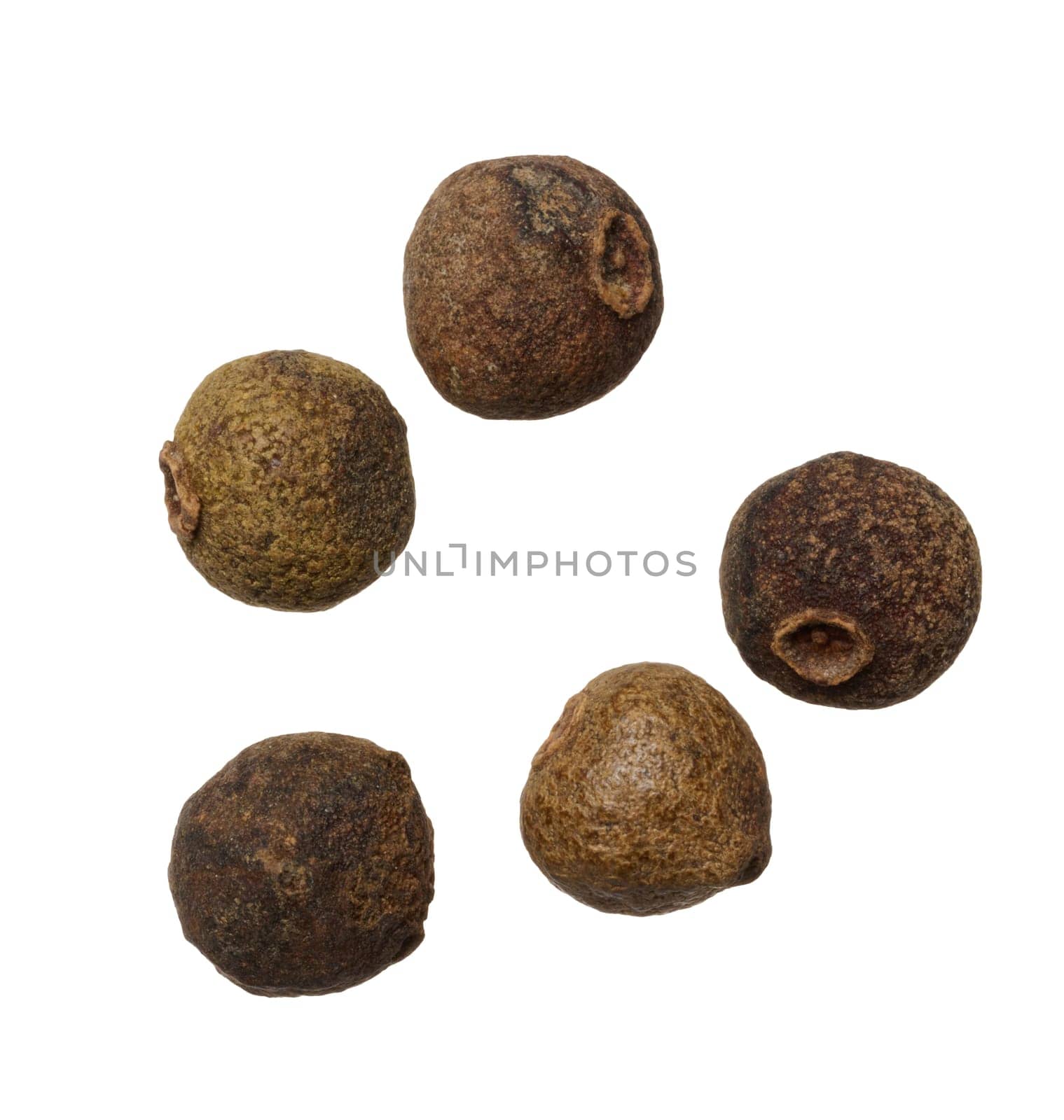 Dry allspice peas on isolated background, top view. Cooking spice