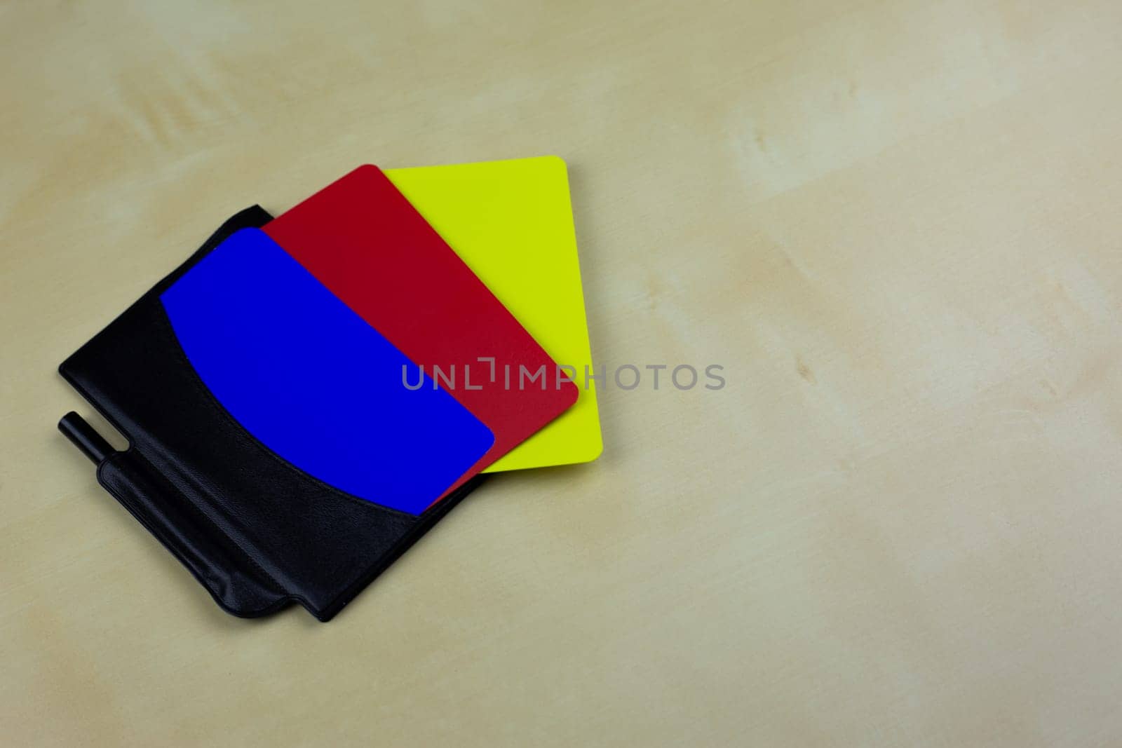 Football referee set for chest pocket with notepad and player cards, blue, red and yellow football card, changes to the rules of the game