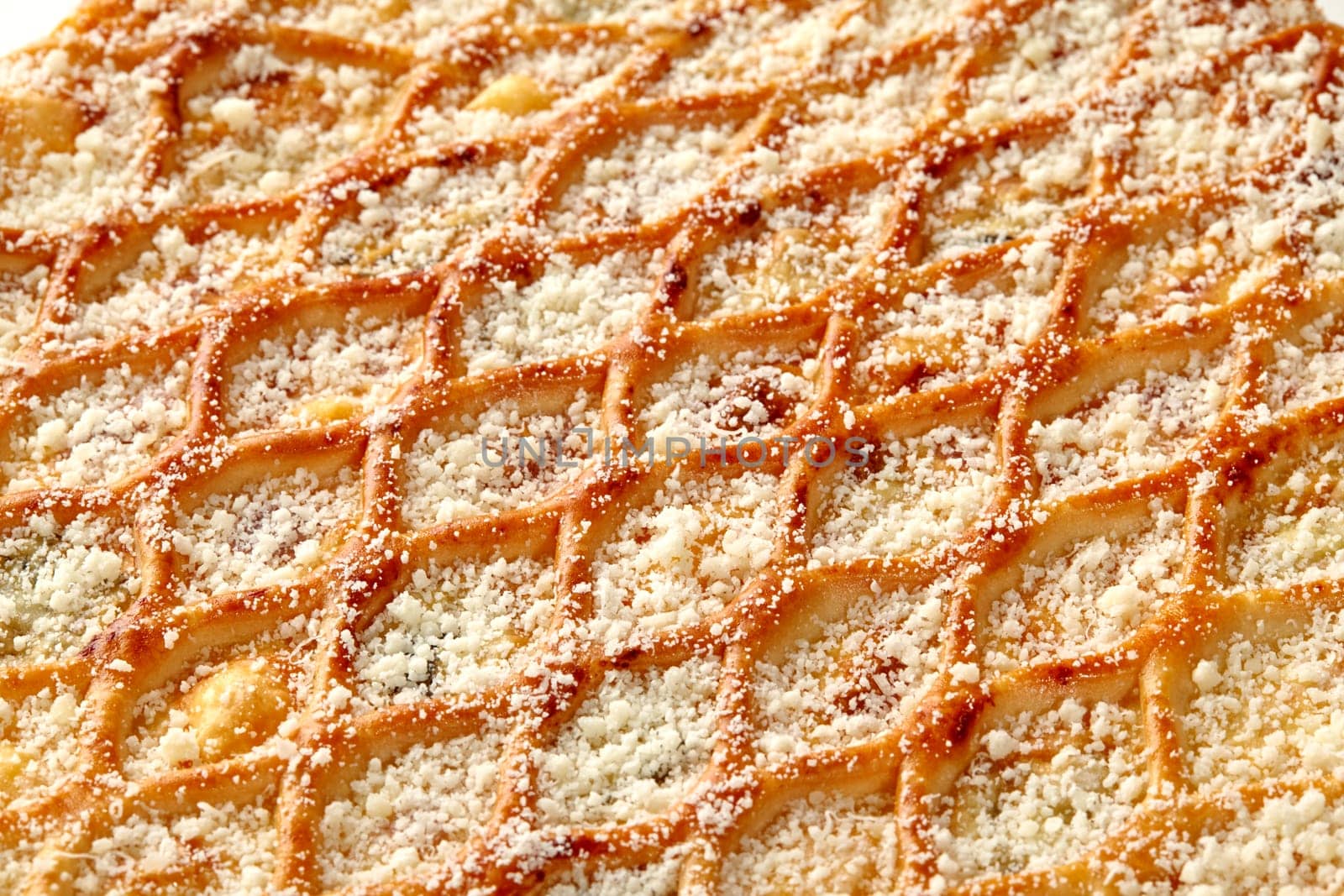 Close-up of savory cheesy lattice pie with Parmesan crumble by nazarovsergey