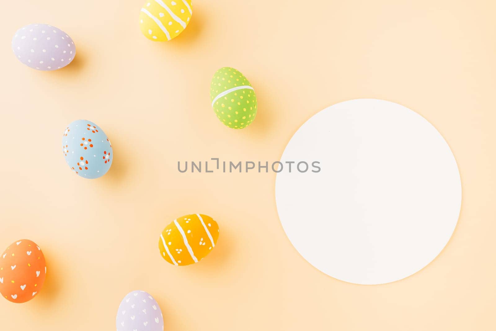 Overhead easter eggs and circle white paper isolated on pastel background with copy space, decoration paper round blank, Happy Easter Day, composition banner web design holiday background, flat lay