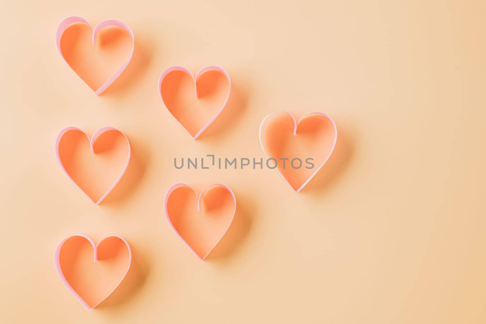 Happy Valentines Day. Above pink ribbon heart shaped decorative symbol isolated on pastel background, love romance concept, template banner design with copy space, Mother, Woman day
