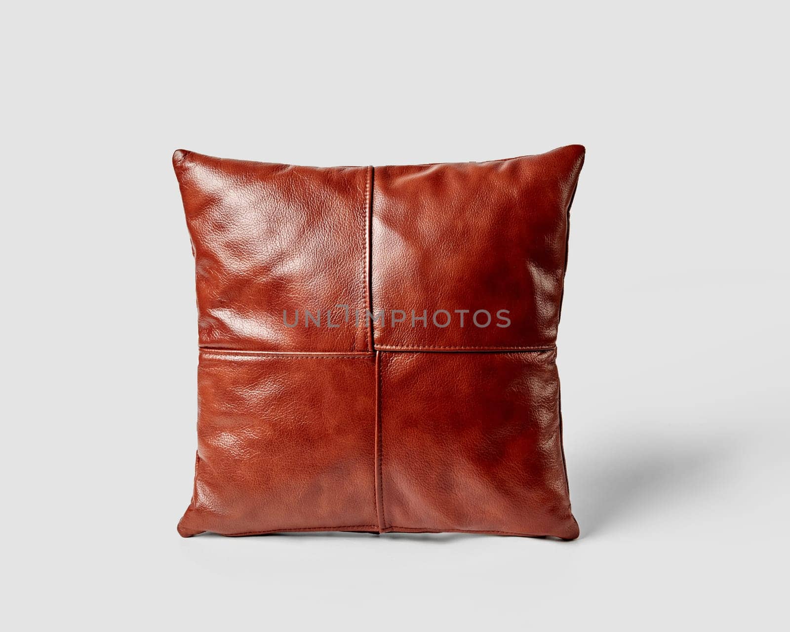 Decorative square couch cushion made of smooth copper-colored leather by nazarovsergey