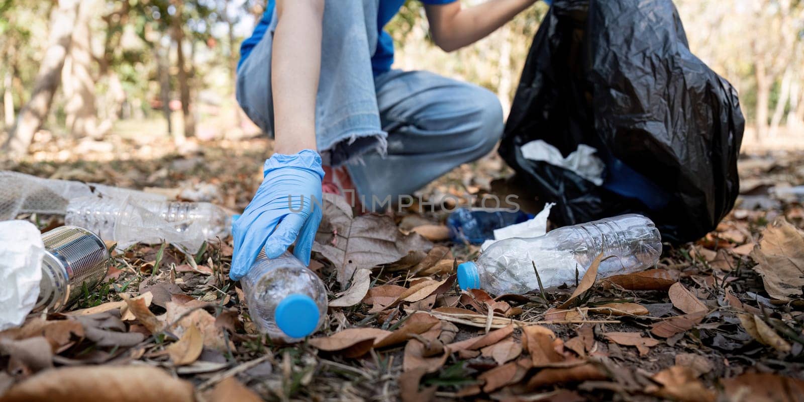 Separating waste to freshen the problem of environmental pollution and global warming, plastic waste, care for nature. Volunteer concept carrying garbage bags collecting the garbage.