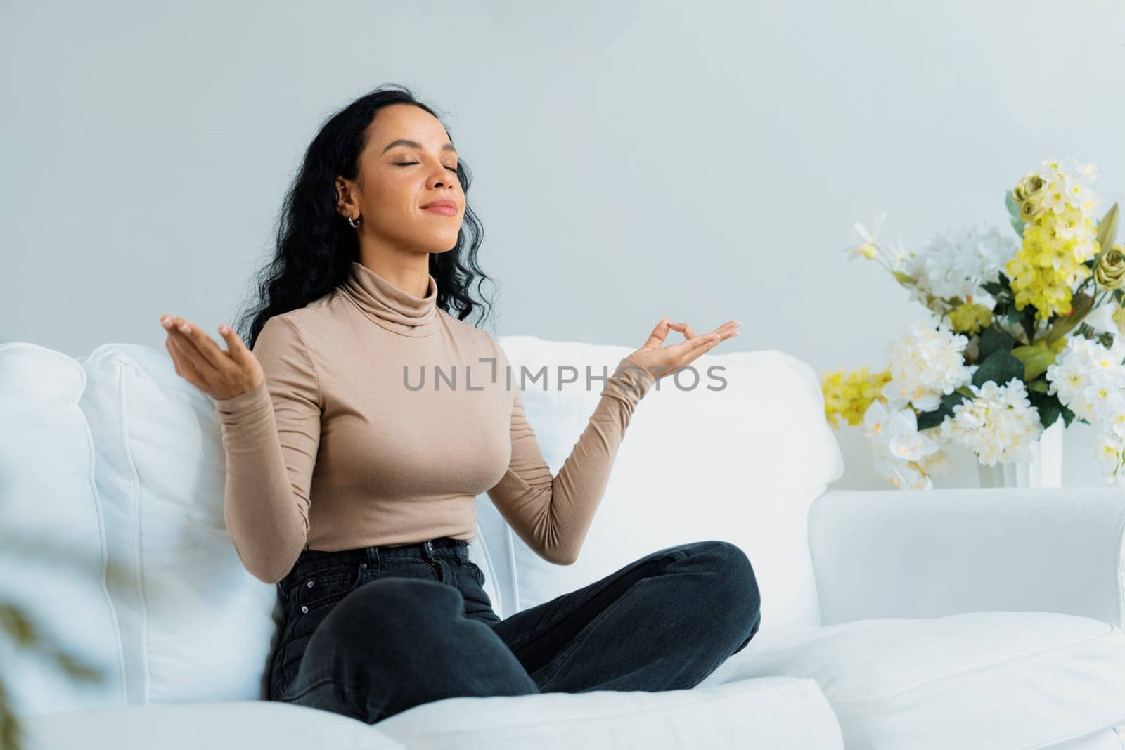 Young African American woman practice crucial mindful meditation at home by biancoblue