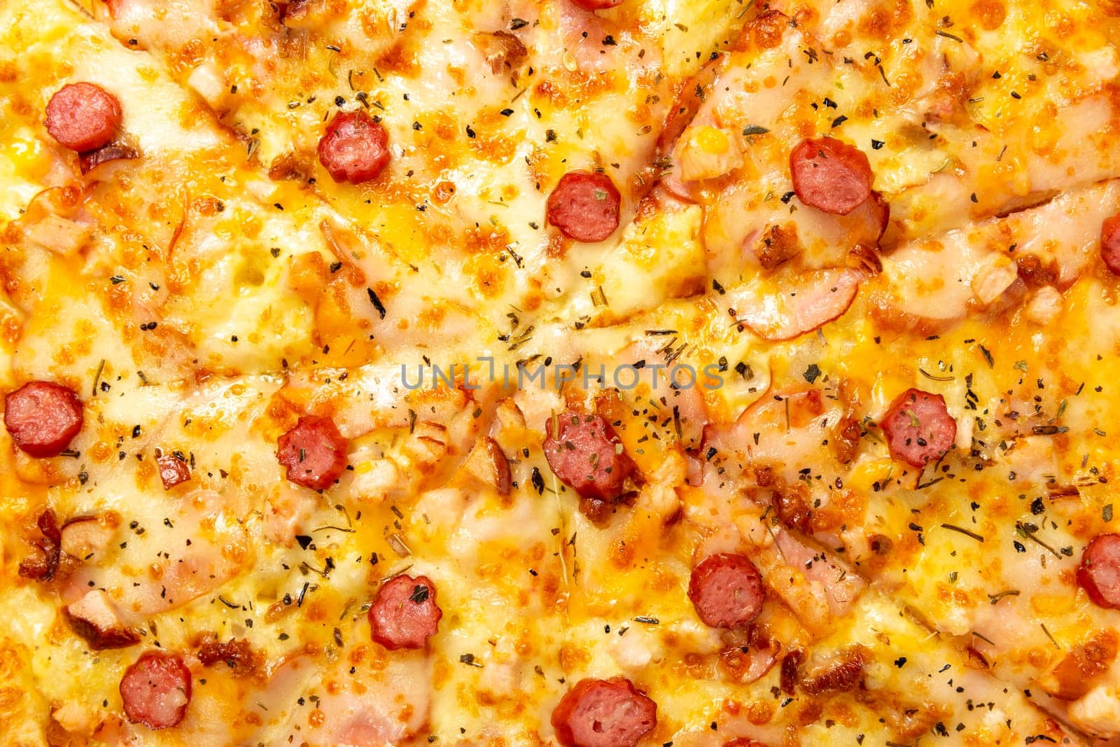 Background with delicious classic italian Pizza with sausages, bacon, pepper and cheese mozzarella. Fresh italian classic original pizza isolated on white background. Top view.