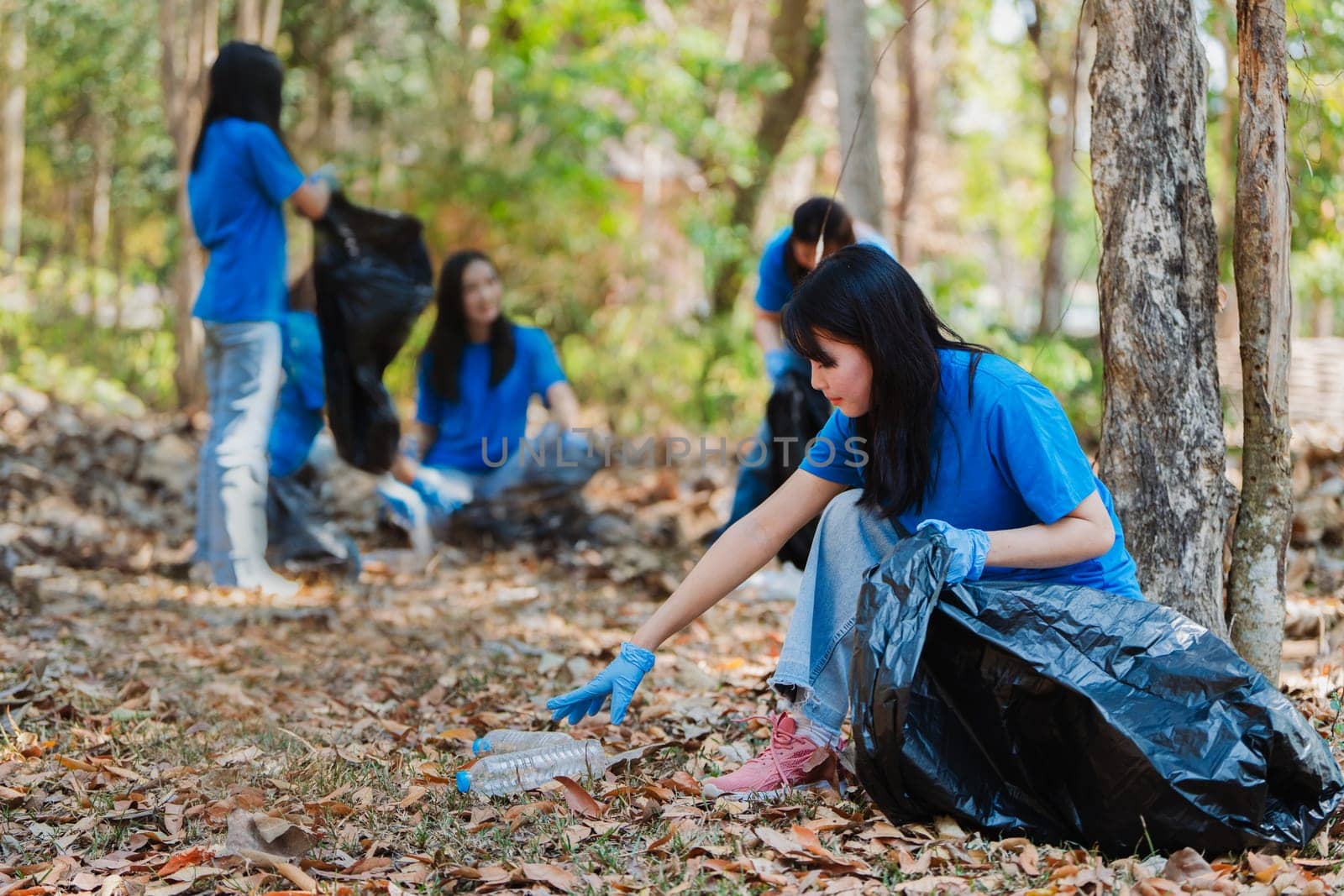 Volunteer team in nature for community service, teamwork and planning with leadership by itchaznong