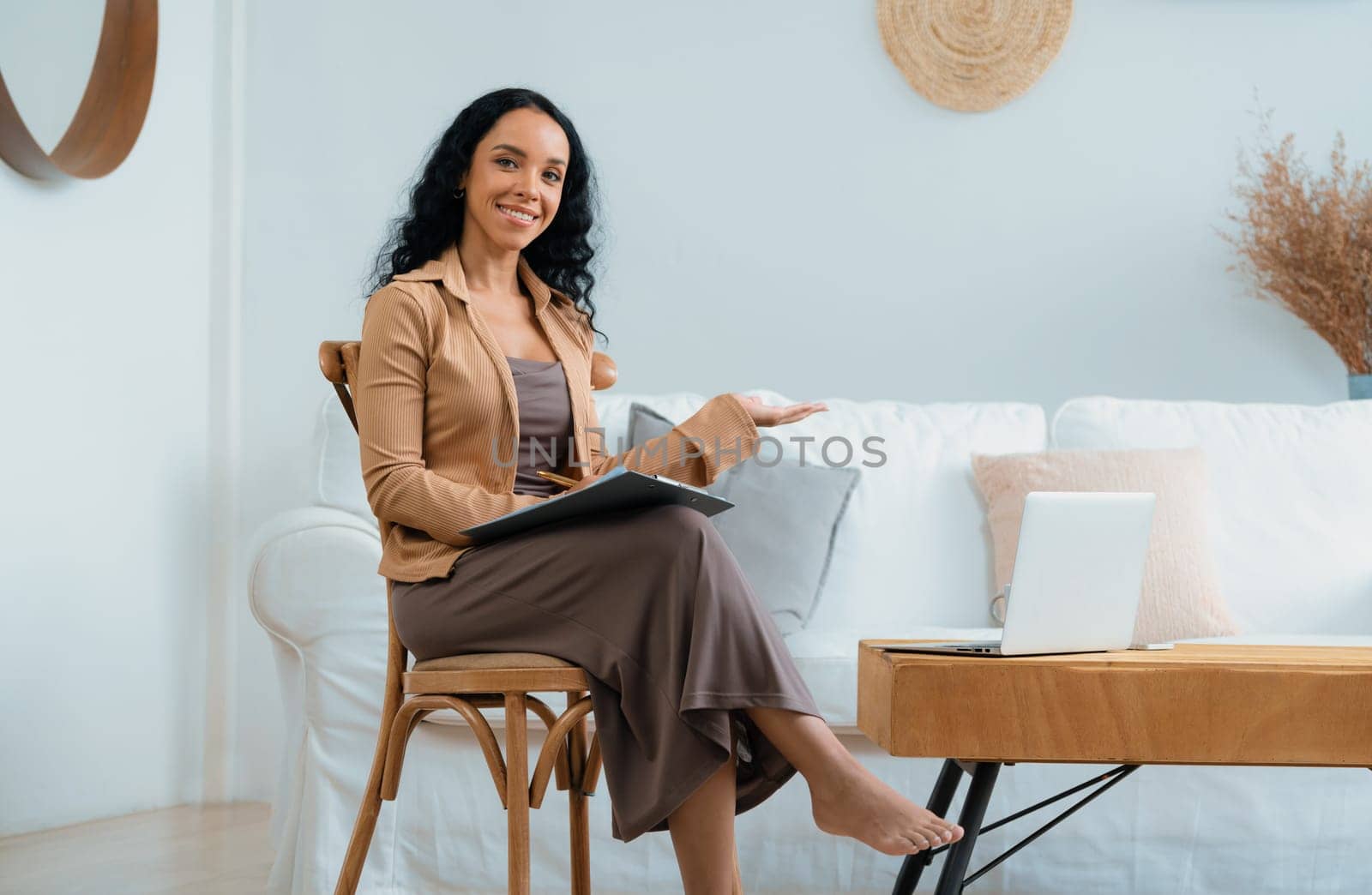 Psychologist woman in clinic office professional portrait with friendly smile feeling inviting for patient to visit the psychologist. The experienced and confident psychologist is crucial specialist