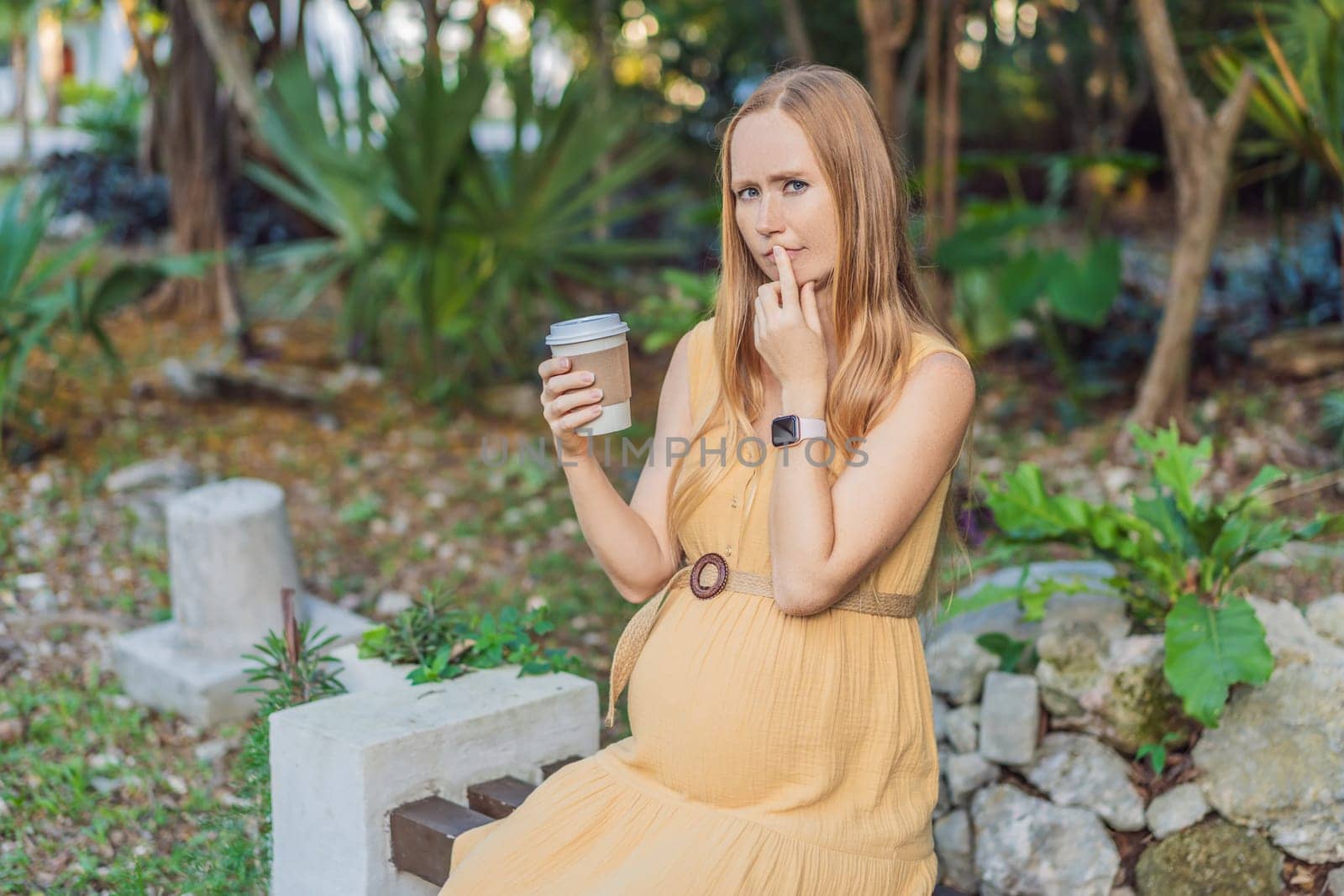 A pregnant woman doubts whether she should drink coffee during pregnancy by galitskaya