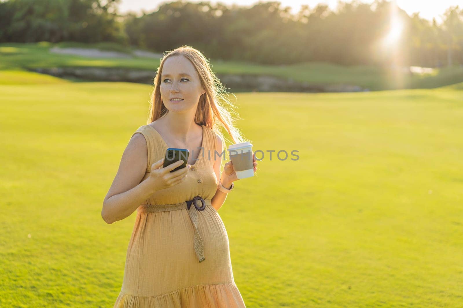 pregnant woman enjoys a cup of coffee outdoors, blending the simple pleasures of nature with the comforting warmth of a beverage during her pregnancy by galitskaya