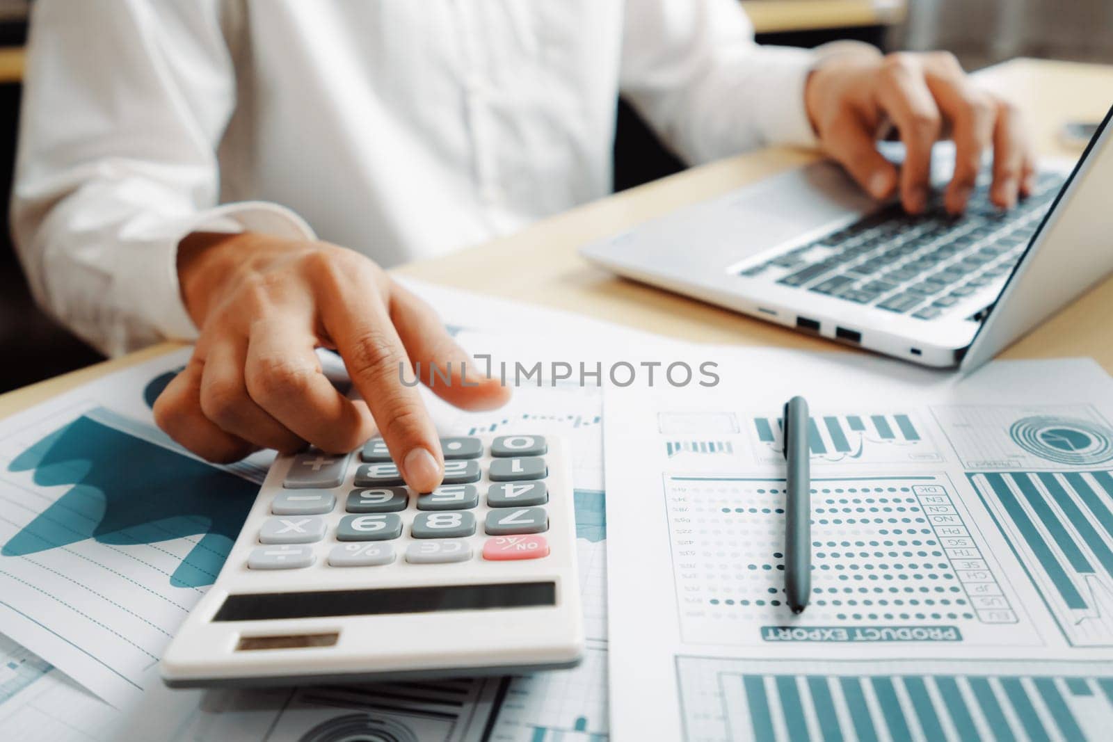 Businessman accountant or financial expert analyze business report graph and finance chart at corporate office. Concept of finance economy, banking business and stock market research. uds