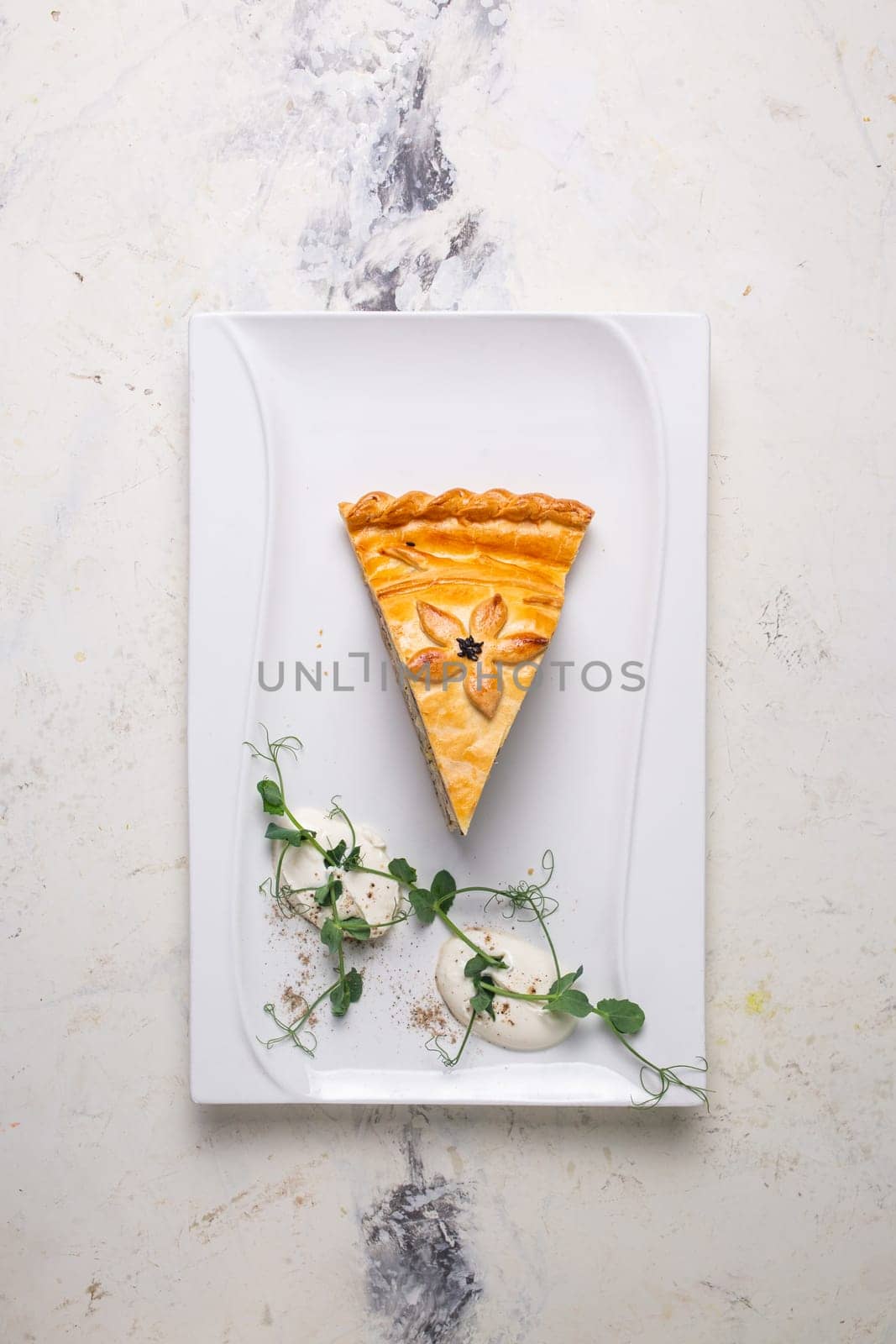 top view multi-layered meat and vegetable savory pie with a golden crust by Pukhovskiy