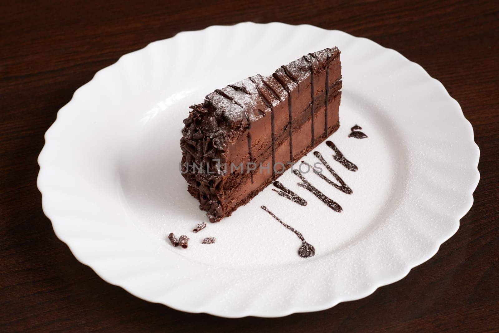 Image of chocolate cake with powdered sugar, close-up