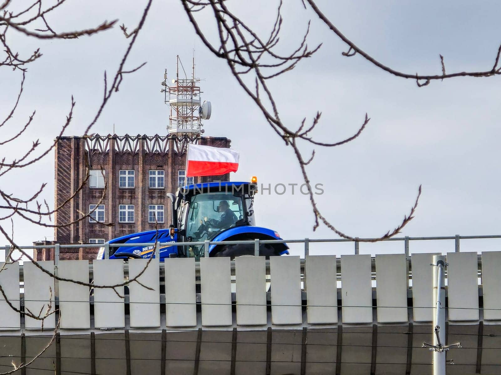 Wroclaw, Poland, February 15, 2024: Protesting farmer on an overpass by stan111