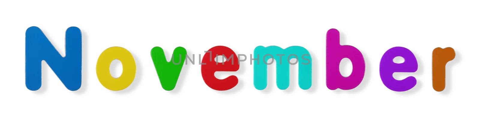 A November word in coloured magnetic letters on white with clipping path to remove shadow