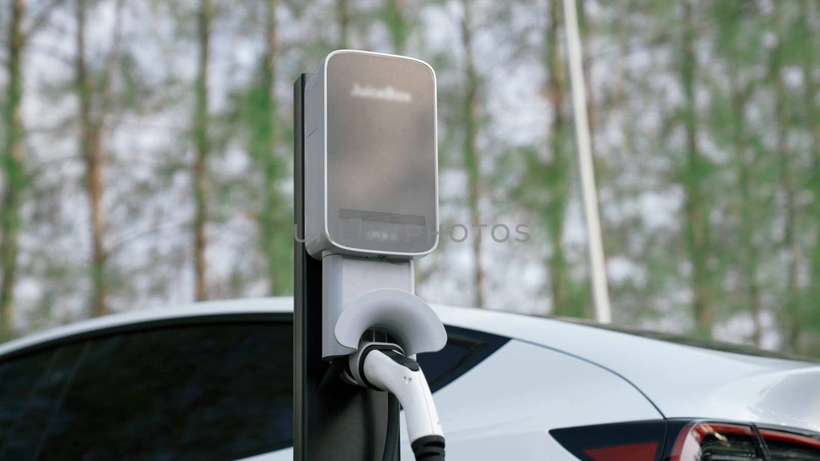 EV electric vehicle recharging battery in national park. Exalt by biancoblue