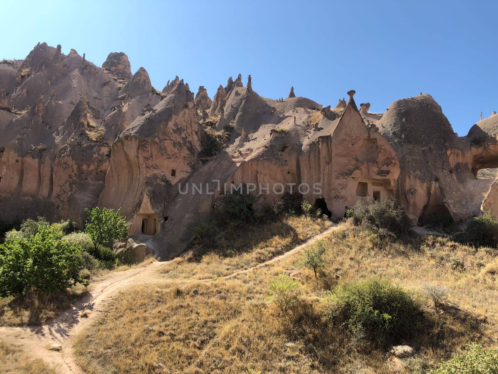 Aerial drone shot of the Fairy Chimneys over the landscape of Goreme, Cappadocia. by WeWander