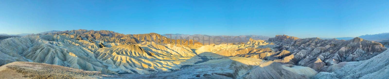 Death Valley Zabriskie Point huge view panorama on sunset sky background